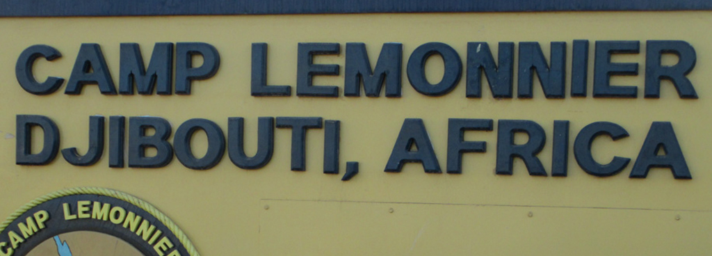 A sign that says Camp Lemonnier Djibouti, Africa