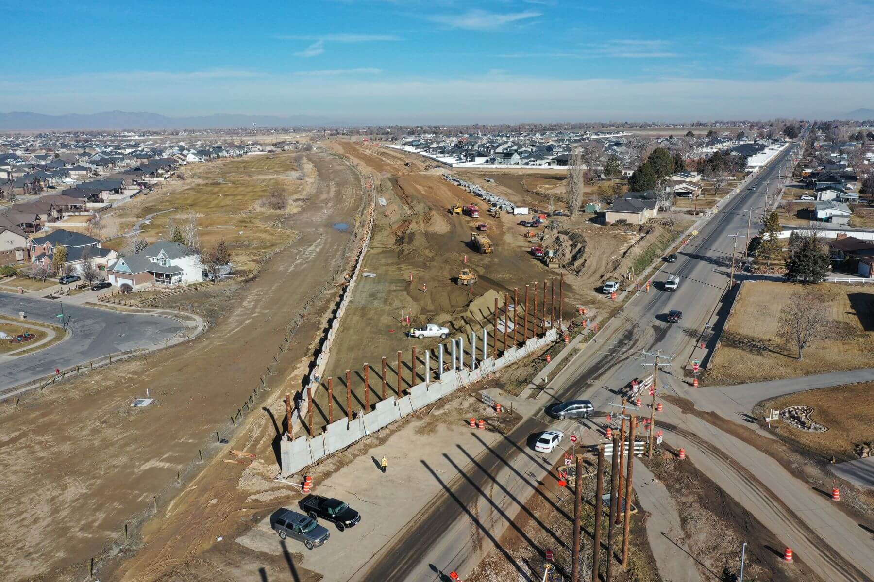 An aerial photograph capturing a construction site with surrounding roadways