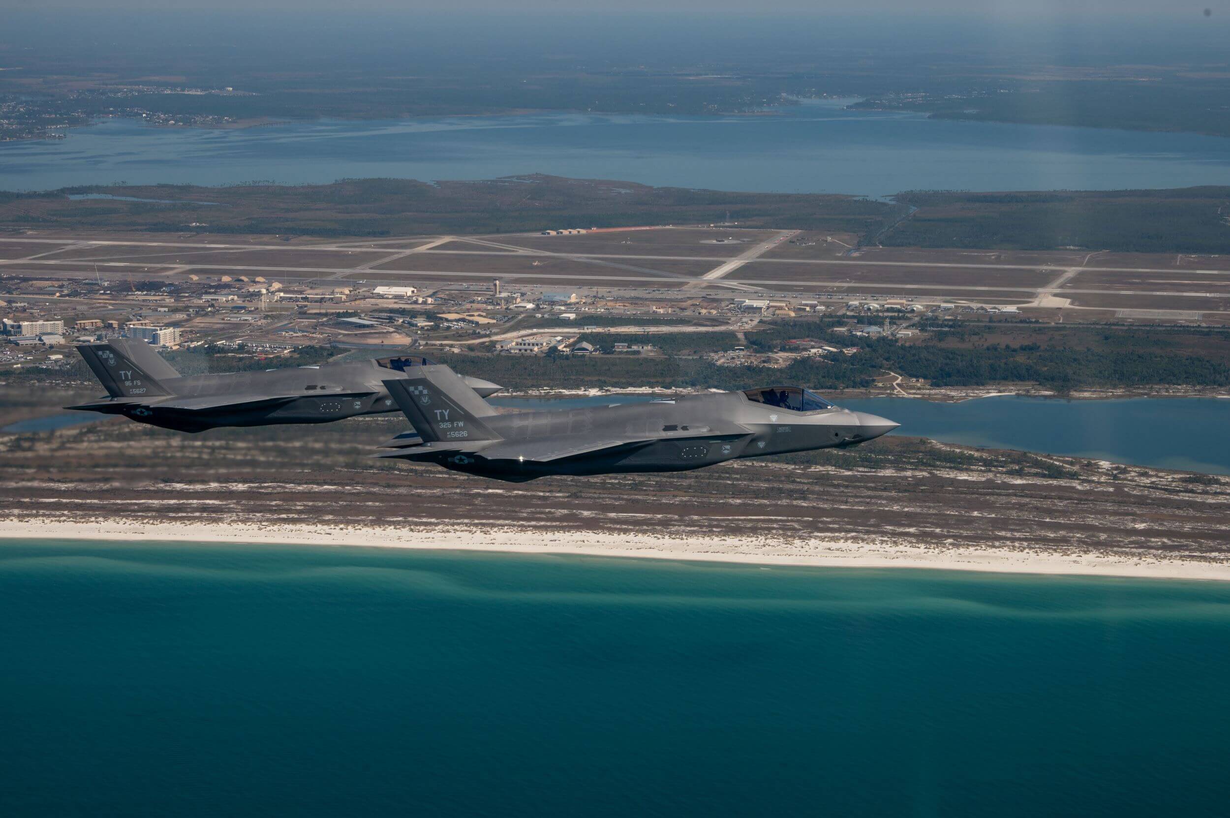 Two F-35A Lightning II jets from the 95th Fighter Squadron fly over Tyndall Air Force Base during an exercise.